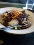 Flank steak  with fresh ginger over rice noodles with roasted peanuts 