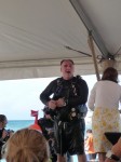 Jose Andres bounds on stage in scuba gear