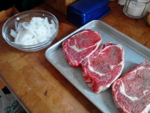 Ribeyes and grilling onions